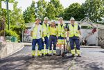 Picture shows a group photo of 5 men in construction site outfits 